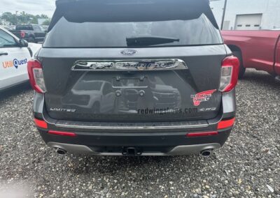 Red vinyl graphics applied to this SUV to make Red Wing Shoes stand out.